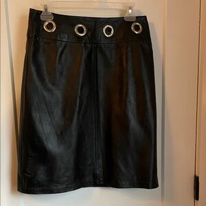 Chic Black Leather Skirt with Grommet Detail and Chain Belt